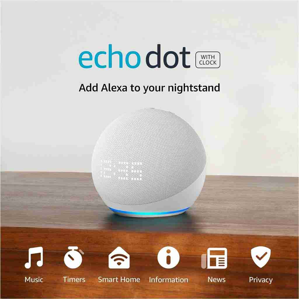 Echo dot on a table with other devices on it.