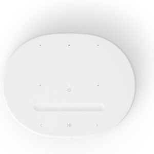 Top view of a white smart speaker with touch controls, including volume, play/pause, and navigation buttons.