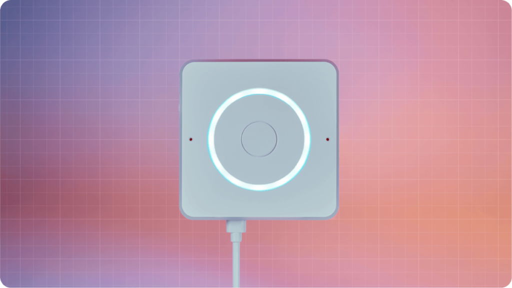 A square white device with a glowing circular light in the center, set against a gradient background of purples and pinks with a grid pattern.